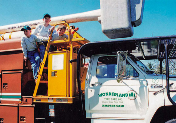Kids exploring the Wonderland Tree Care truck.
